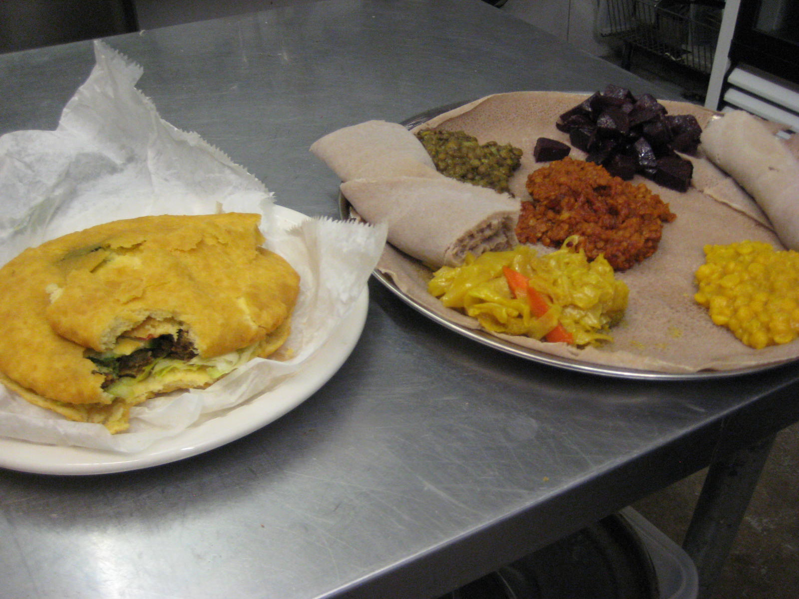 Caption: At RAS, you can order Caribbean food (like the Bake and Shark, left) or Ethiopian cuisine (like the vegetarian platter, right)., Credit: Rebecca Sheir