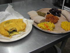 Caption: At RAS, you can order Caribbean food (like the Bake and Shark, left) or Ethiopian cuisine (like the vegetarian platter, right)., Credit: Rebecca Sheir