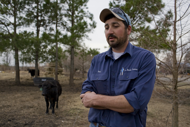 Caption: Ben Haines & his cow