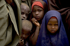 Caption: Somali children waiting to register for food and other aid in the Dagahaley refugee camp in North Eastern Province, near the Kenya-Somalia border. The camp is among three that comprise the Dadaab camps, located on the outskirts of the town of Dadaab in Ga, Credit: © UNICEF/NYHQ2011-0999/Holt