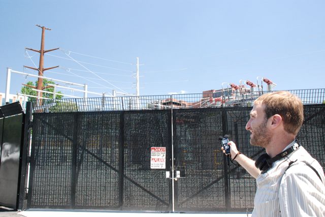 Caption: Ross Chambless stands outside a substation near his home in Salt Lake City., Credit: Ross Chambless
