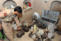 800px-ana_soldier_shows_opium_captured_in_an_alleged_taliban_safe_house_in_helmand_square_small
