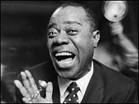 Caption: Louis Armstrong, pictured here in 1956, produced hit films and records throughout his long career., Credit: Getty Images