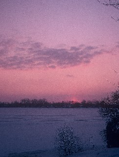 Caption: Sunset on ice coated Sylvan Lake, Pontiac, Michigan, Credit: C. Warren