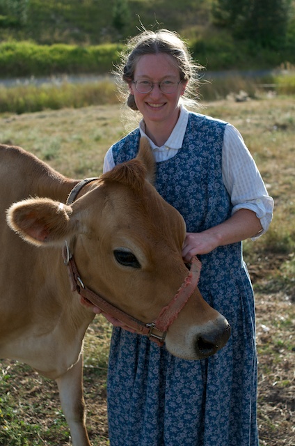Caption: Amy Wincentsen of Little Bear Dairy, a raw milk dairy, with Butterscotch., Credit: Guy Hand