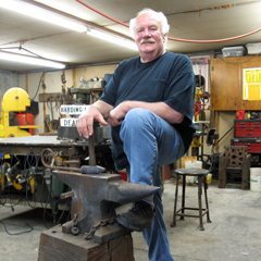 Caption: Bob Jordan with his anvil, Credit: JP Davidson