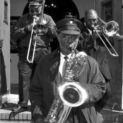 Caption: The Dirty Dozen Brass Band's Roger Lewis at a jazz funeral in 2010., Credit: Kim Welsh