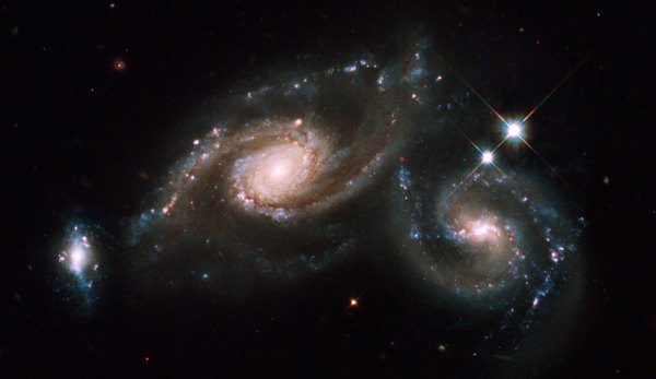 Caption: Clockwise and counterclockwise galaxies from the Hubble Telescope, Credit: NASA, ESA, M. Livio and the Hubble Heritage Team, STScI/AURA