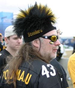 Caption: Symptoms of extreme fandom can sometimes include the wearing of funny hats., Credit: Image courtesy of Flickr user seantoyer.