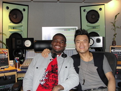 Caption: Rayon Wright with K-Pop Artist JYP