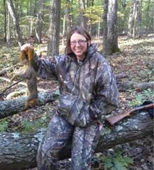 Caption: Bekie Stergar with the her kill. Brown County, Indiana, 2011. Gun pictured is a 22 caliber rifle. , Credit: submitted photo