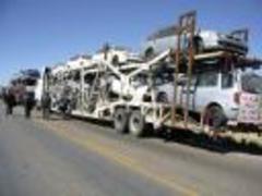 Caption: "Autos Katrina" are taken into Bolivia from Chile, Credit: Ruxandra guidi