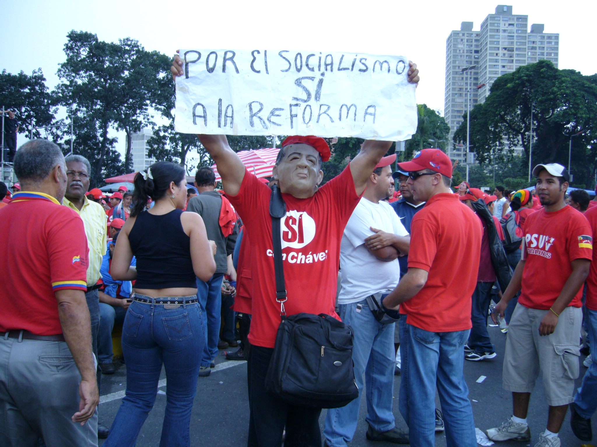 Caption: A Chavez supporter holds a sign during a rally in Caracas, Credit: Ruxandra Guidi