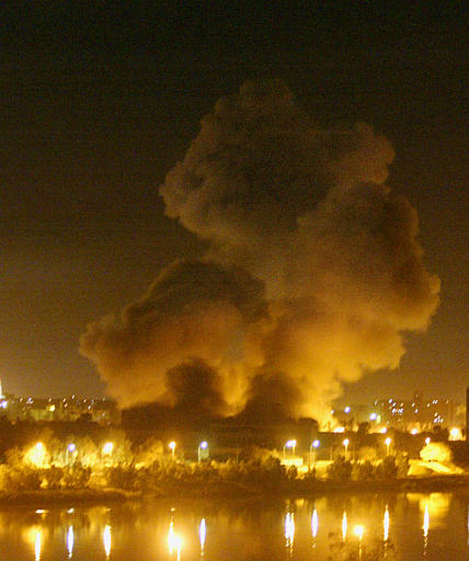 Caption: A bomb hits the Information Ministry in Baghdad at the start of the US invasion in March 2003., Credit: Associated Press