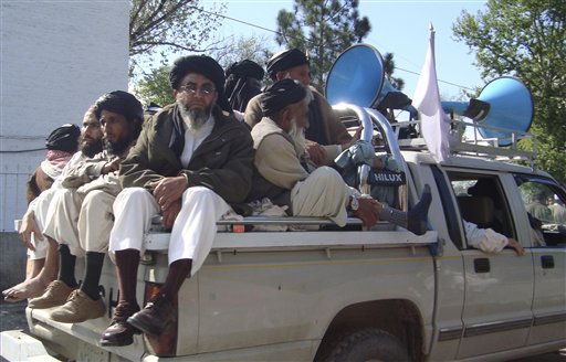 Caption: Supporters Pakistan's hard-line cleric Sufi Muhammad leave Mingora in Pakistani troubled Swat valley on Thursday, April 9, 2009., Credit: Courtesy of the Associated Press