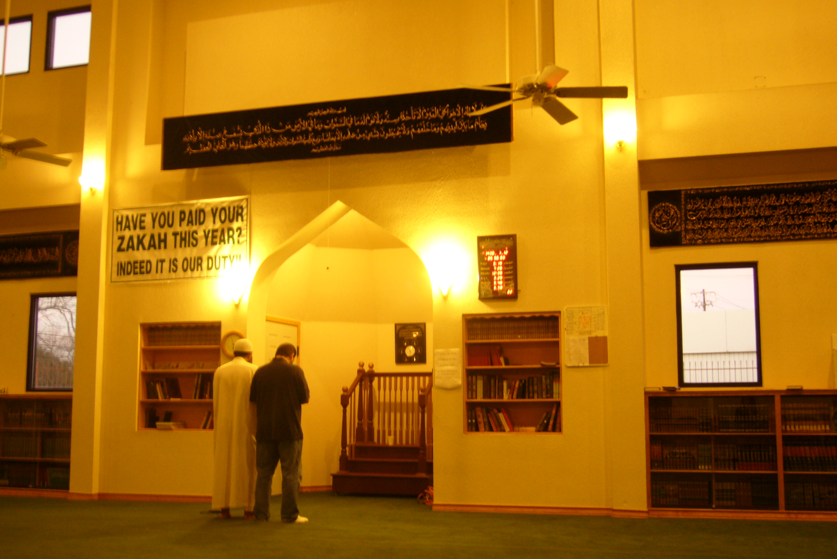 Caption: Mohammed Al Bedaiwi joins the Imam for evening prayer., Credit: Photo by Ruxandra Guidi.