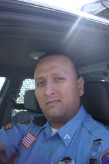 Caption: Laredo Police Department officer Joe Baeza in his patrol car., Credit: Ruxandra Guidi