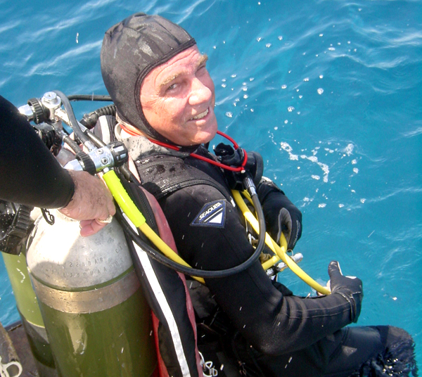 Caption: Chris Martens getting ready to 'splash' and dive 50 feet underwater to live in the Aquarius Undersea Laboratory for a 10-day mission., Credit: Mark Hulsbeck