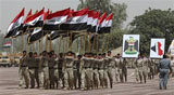 Caption: Iraqi security forces parade in Tikrit, Iraq., Credit: Photo courtesy of the AP.