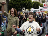 Caption: Marlene Sanchez of Long Beach, Calif, foreground, chants with other anti-war activists during a rally through the Hollywood area of Los Angeles protesting against the wars in Iraq and Afghanistan on Saturday, March 21, 2009, Credit: Associated Press