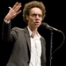 Caption: Malcolm Gladwell, telling a story live at The Moth.
