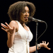 Caption: Sarah Jones, telling a story live at The Moth.