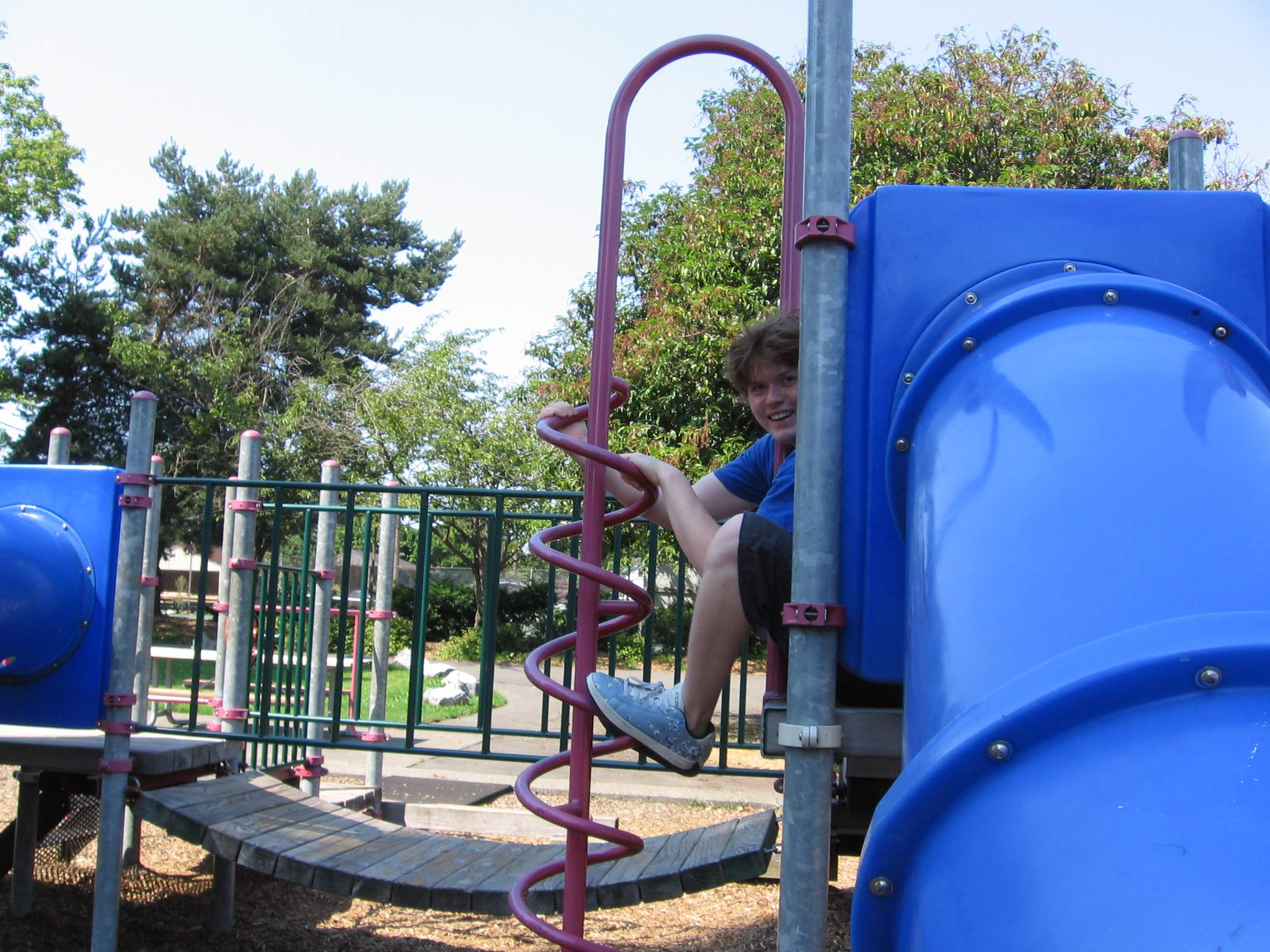 Caption: Bryce Ellis enjoys a day at the park, just like in his earliest childhood memories, Credit: Molly Anderson