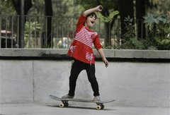Caption: An Afghan girl practices skateboarding in a park in Kabul, Afghanistan., Credit: Photo courtesy of Associated Press.