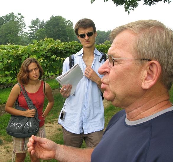 Caption: Frank Reinhold, owner of Flag Hill Winery, addresses the students, as Annalisa Sivieri and Paolo Camozzi look on., Credit: Avishay Artsy