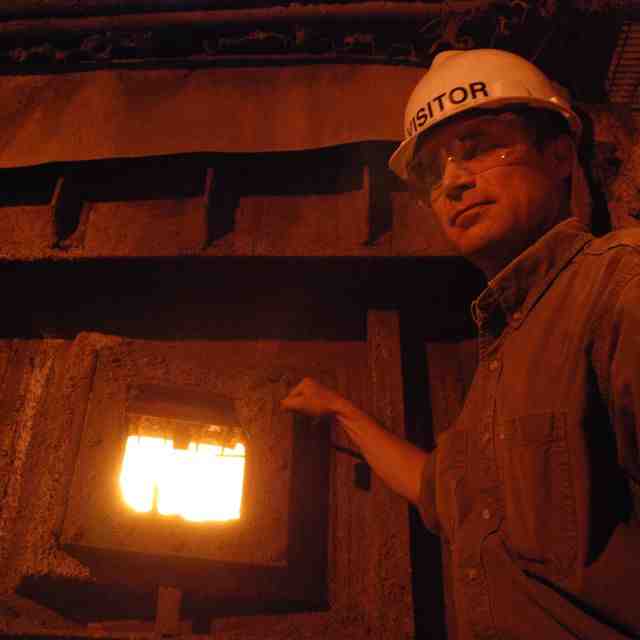 Caption: Nathan Rich, Executive Director of the Wasatch Integrated Waste Management District, offers a glimpse of his waste incineration furnace.