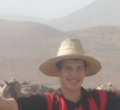 Caption: Beno Picciano poses amid the Atlas Mountains in Morocco. He spent time there during the summer of 2008 living with a host family.