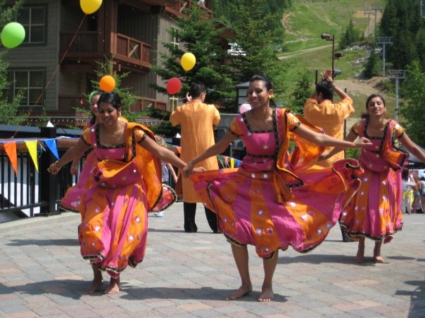 Caption: Raakhi Sinha, host of The Subcontinental, breaks out the Bolly moves with her crew