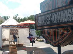 Caption: Vendors setting up for Harley Bike Rally at the House of Harley. Tens of thousands are expected to attend.