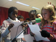Caption: Richton Park school kids in Chicago interviewing Berlin Kids live