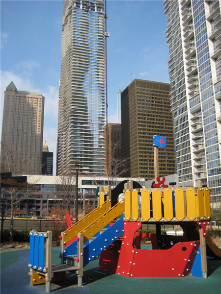 Caption:  The new Aqua tower is nearing completion at the northwest corner of Lakeshore East, a development that’s drawn families with kids and empty-nesters to downtown., Credit: WBEZ/Ashley Gross