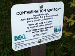 Caption: Imerman Park sits on the flood plain of the Tittabawassee River.  Signs along the trail warn visitors about dioxin contamination in some of the park's soil., Credit: Shawn Allee