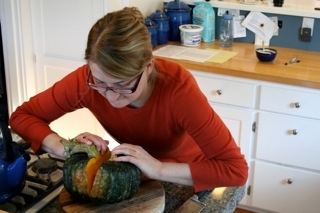 Caption: Jess Thomson cracks open a kabocha squash., Credit: Megan Sukys