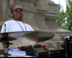 Caption: Drummer Vimont Brogsdale performs on Chicago's Michigan Avenue, Credit: Chris Sewell
