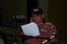 Caption: Cochise Anderson at the Mic During A Skit in "Dress" Rehearsal, Credit: John Gregg, Sr.