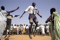 Caption: South Sudanese dancing to celebrate peace in 2005., Credit: Associated Press