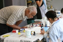 Caption: Charles Blackwell teaching at LightHouse for the Blind