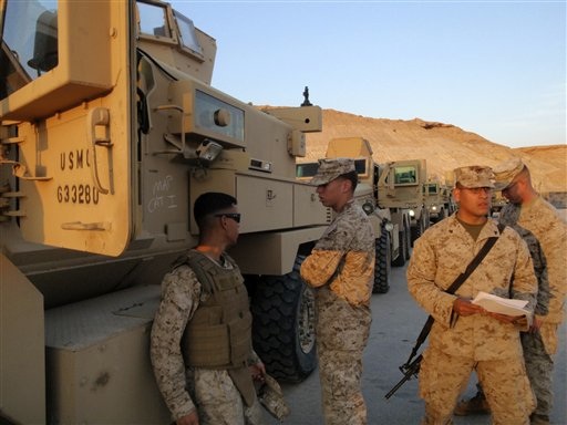 Caption: American armored trucks used on patrol in Anbar province., Credit: Photo courtesy of the Associated Press.
