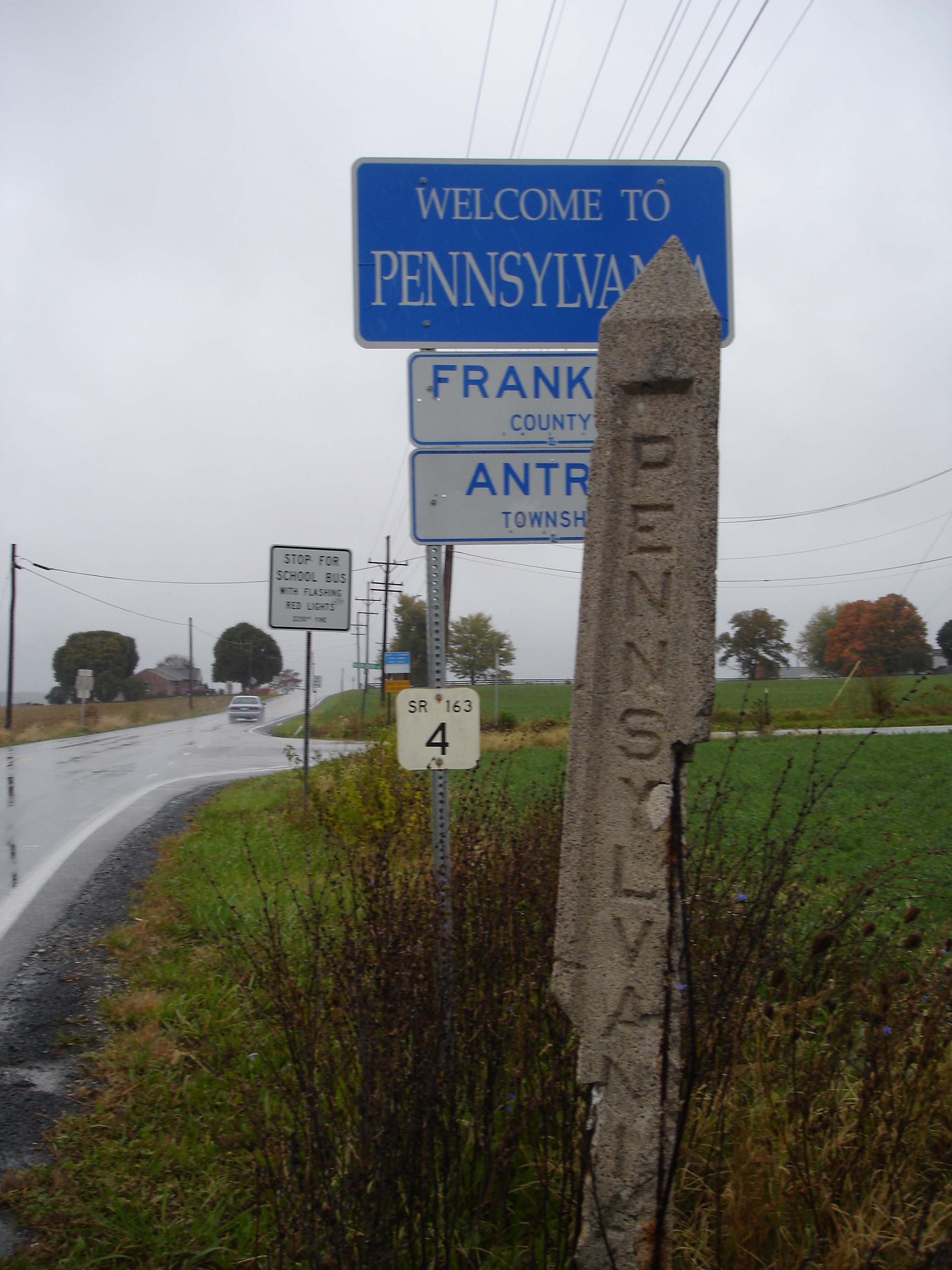Caption: A mile marker along the Mason-Dixon Line., Credit: Tamara Keith