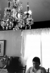 Caption: Nathan Dyer focuses hard — really hard — on the chandelier., Credit: Morrigan McCarthy