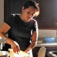 Caption: Gabriela Cubillos prepares tamales in her home. , Credit: Eroyn Franklin