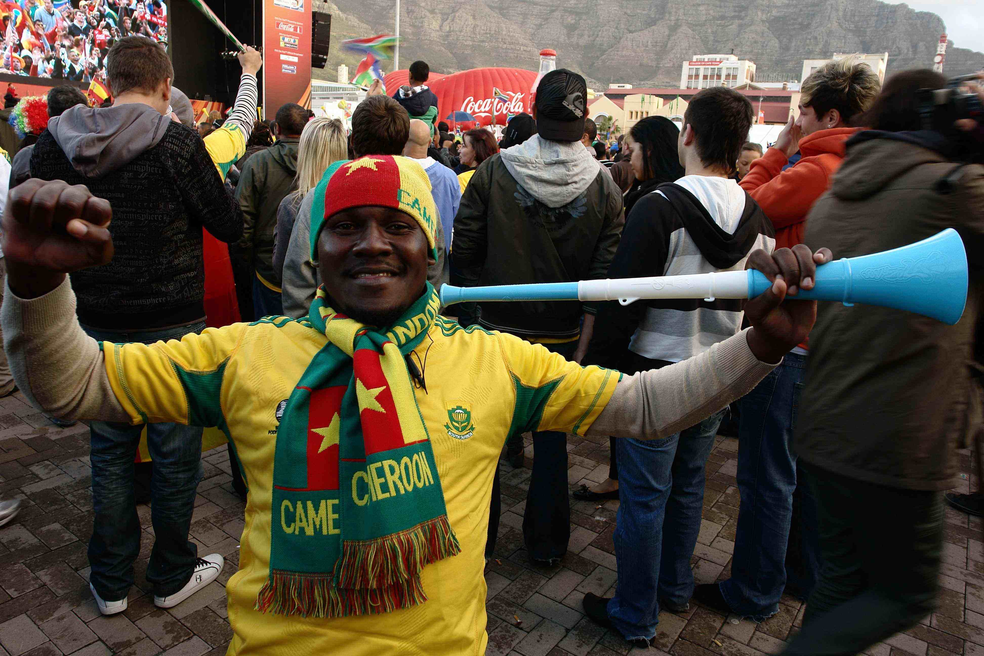 Caption: A Cameroon Fan sports a South Africa soccer jersey and supports BOTH teams during the groups stage of 2010 Soccer World Cup, Credit: Photo by Brice Kimbembe for Yenza (Copyright Yenza 2010)