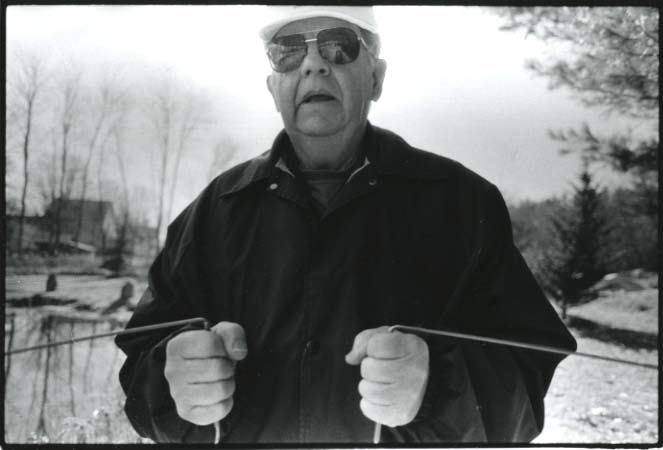 Caption: Glenn Johnson's business card reads "Dowswer, Consultant to the Universe.", Credit: Katherine Hays