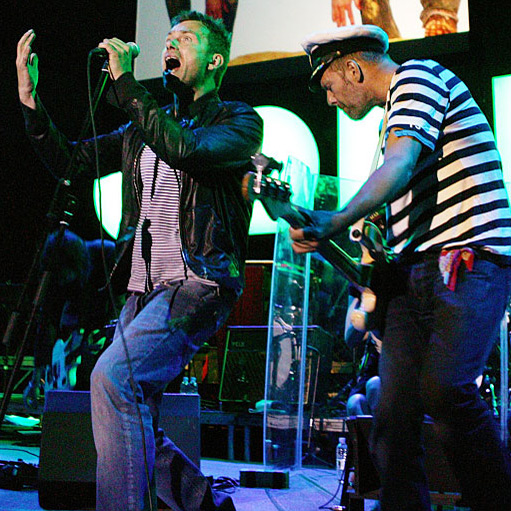 Caption: Gorillaz's members, including Blur's Damon Albarn, perform without their typical cartoon disguises., Credit: Courtesy of the artist