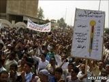 Caption: Iraqis protest against lack of electricity and high temperatures., Credit: Photo courtesy of Reuters.