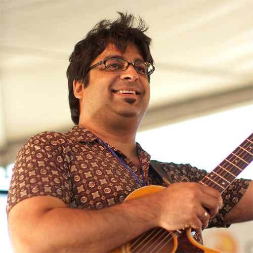 Caption: Rez Abbasi performs at the CareFusion Newport Jazz Festival 2010., Credit: Erik Jacobs for NPR